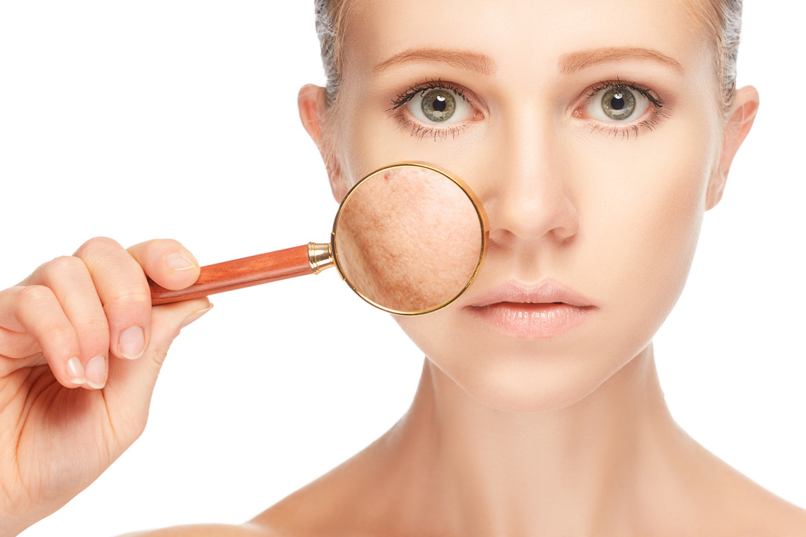 concept skincare. Skin of woman with magnifier before and after the procedure